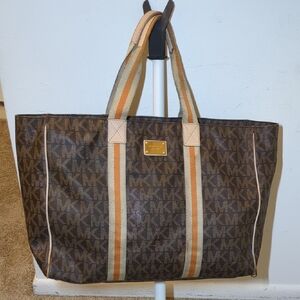 x sold xMichael Kors Brown and Tan Travel Bag